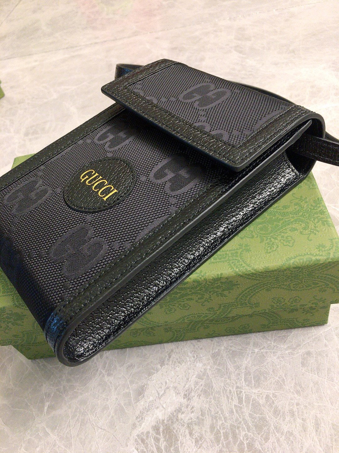 Gucci GG Embossed Leather Pouch Wallet