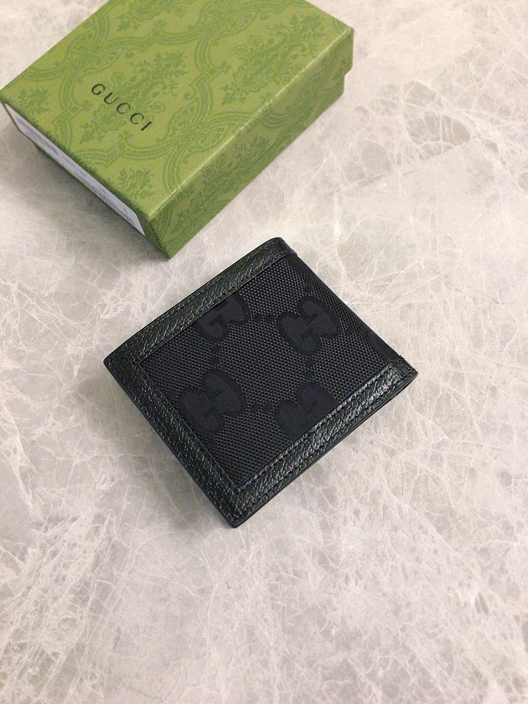 Gucci GG Embossed Zip Wallet Collection