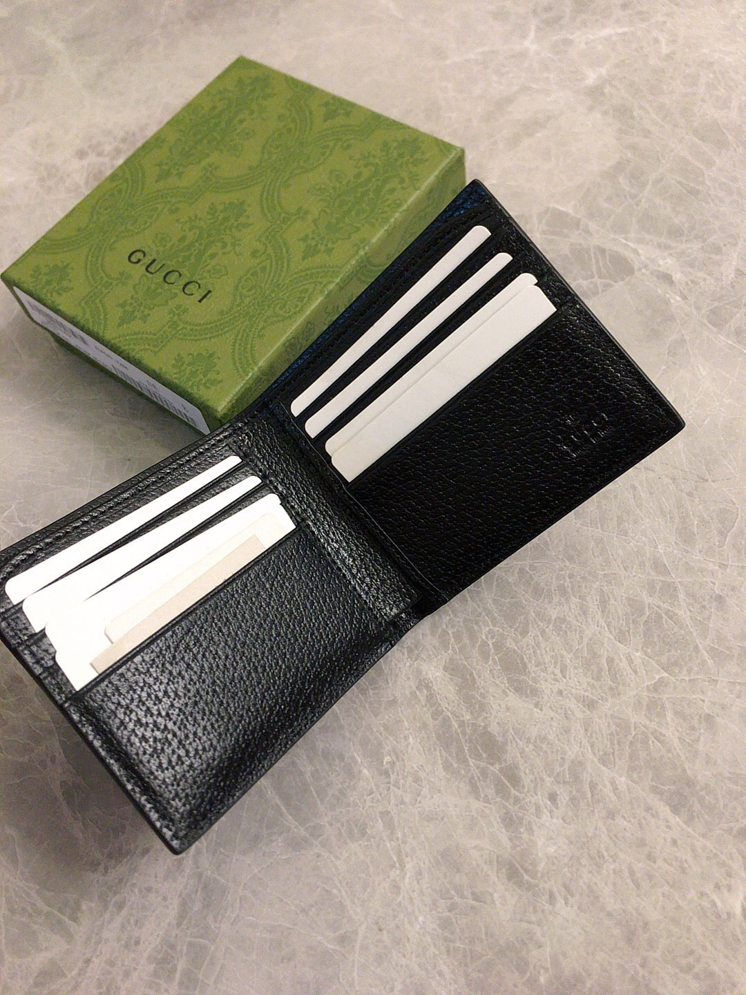 Gucci GG Embossed Zip Wallet Collection