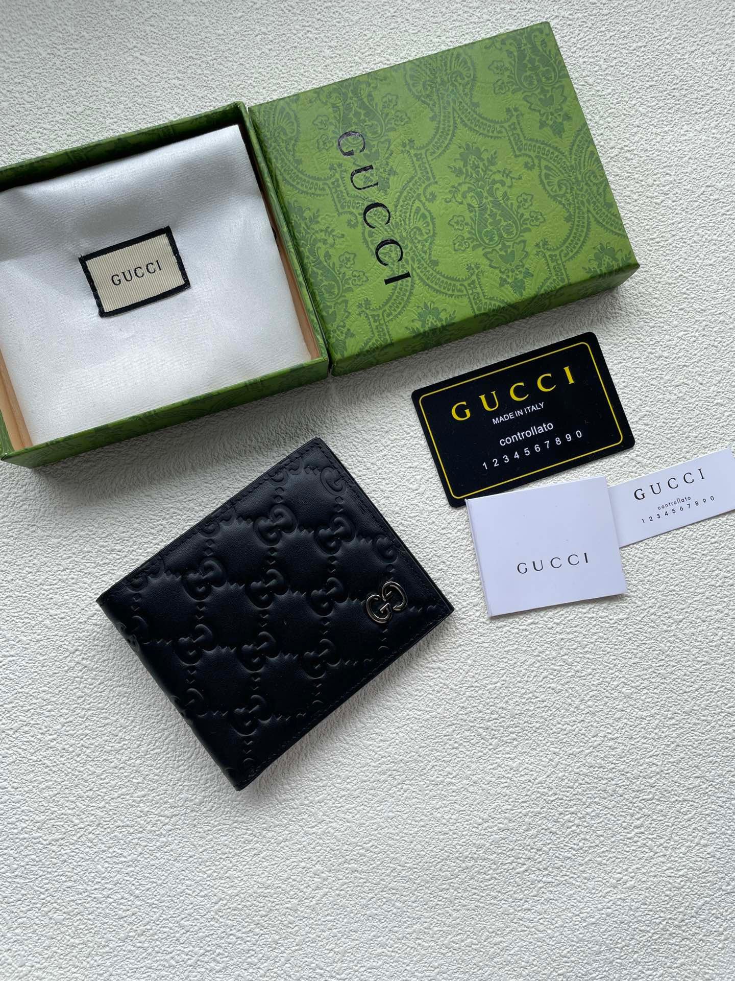 Gucci Black GG Embossed Wallet – Gold Monogram Emblem Edition