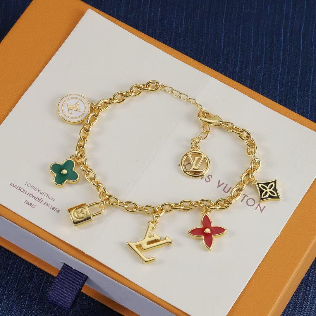 Louis Vuitton Monogram Bag Charms & Keychains – Gold Chains with LV Initials & Floral Enamel Charms