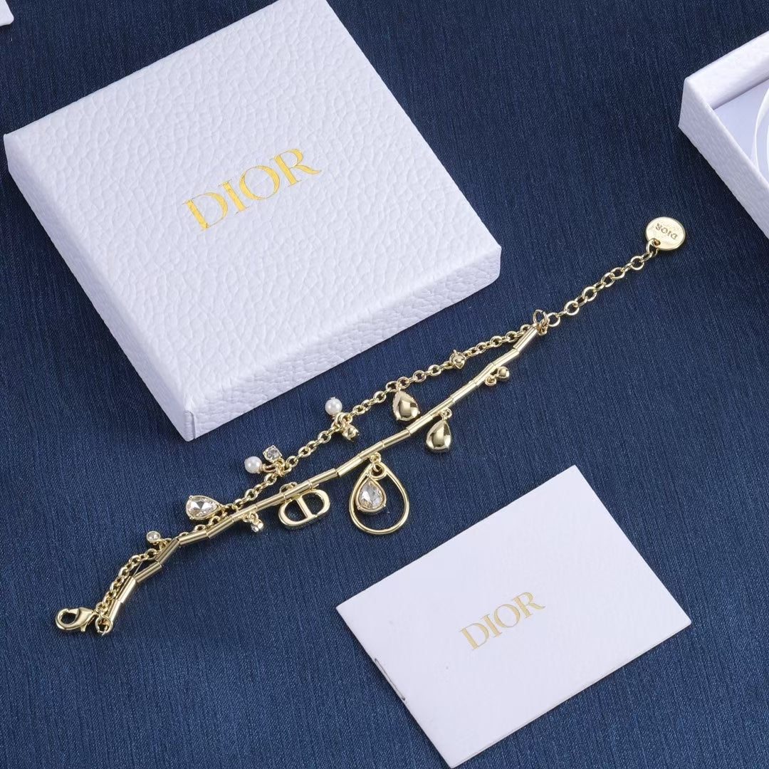 Dior Charm Bracelet – Gold-Tone Dual Chain with CD Logo, Gemstone & Pearl Accents