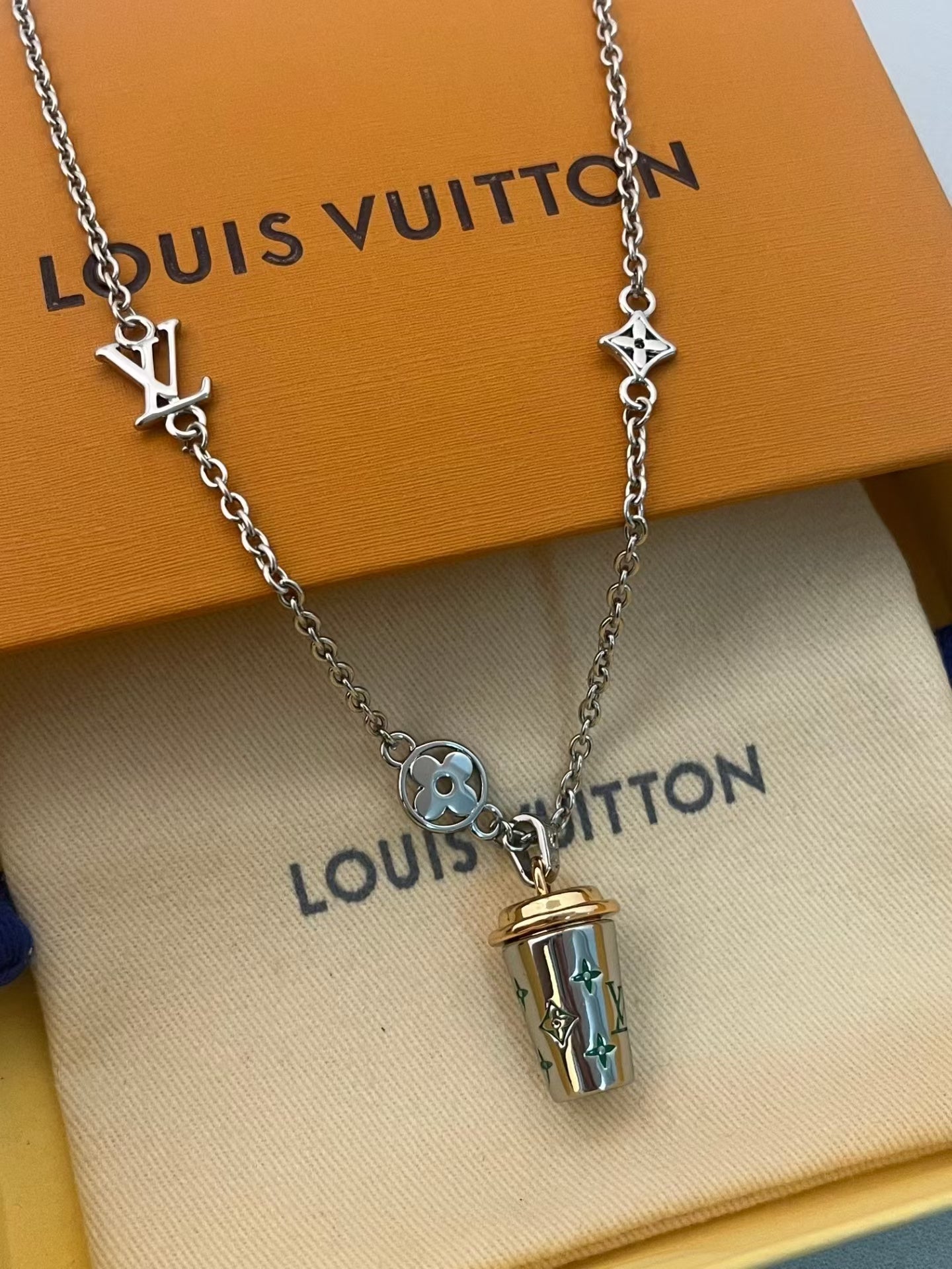 Louis Vuitton Monogram Cup Charm Necklace – Silver Chain with Iconic LV Motifs