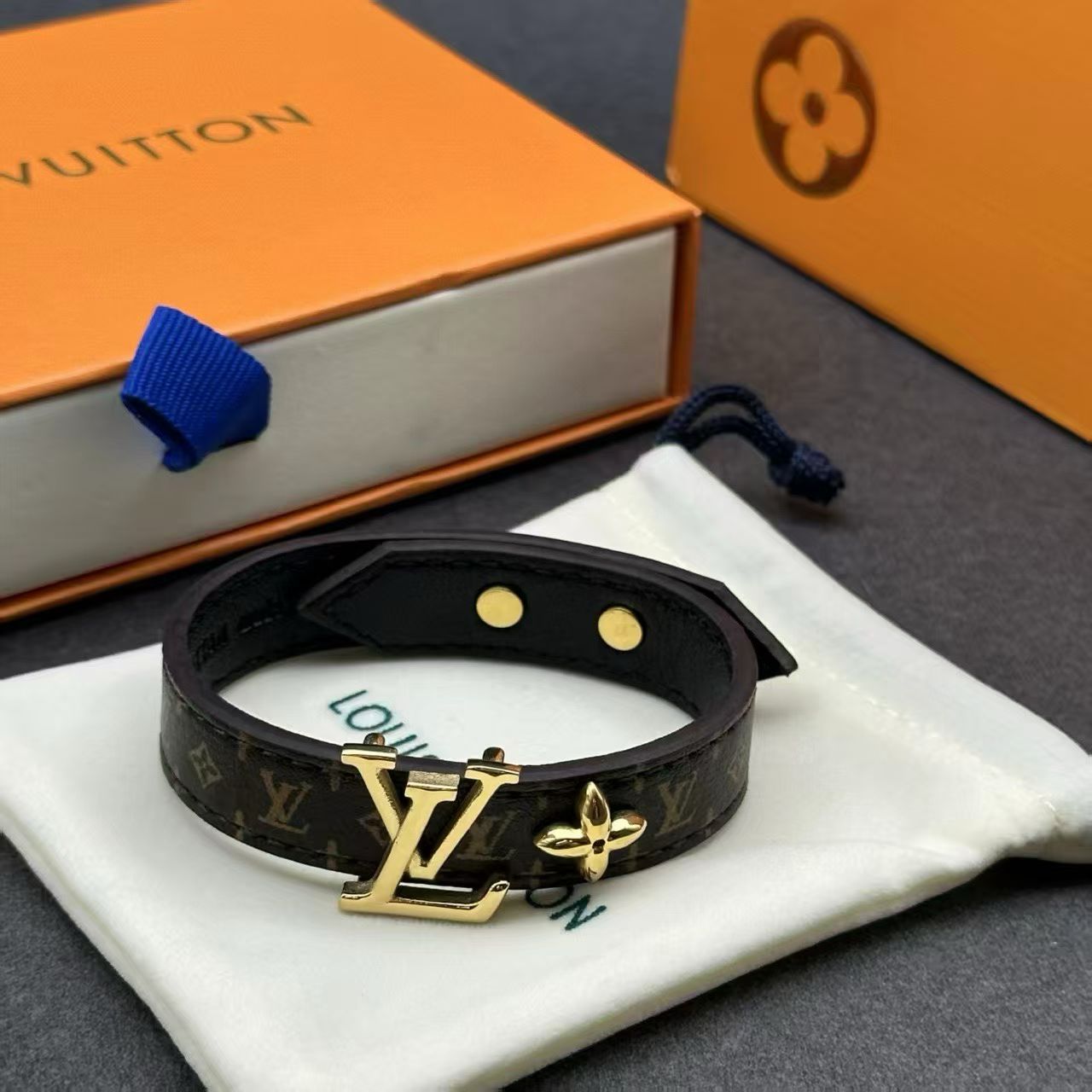 Louis Vuitton Monogram Leather Bracelet – Brown Canvas with Gold LV Logo & Fleur Charm