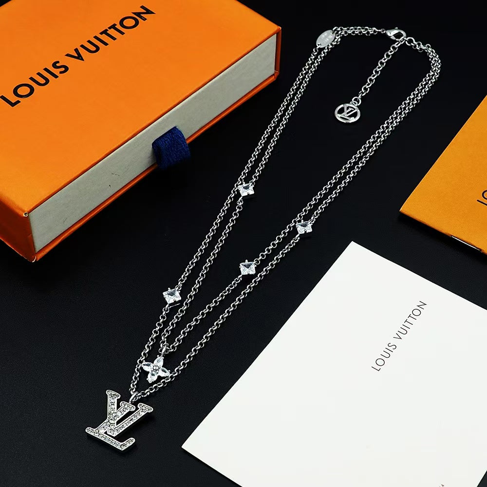 Louis Vuitton Crystal LV Jewelry Set – Gold-Tone Necklace & Bracelet with Sparkling Logo Pendants