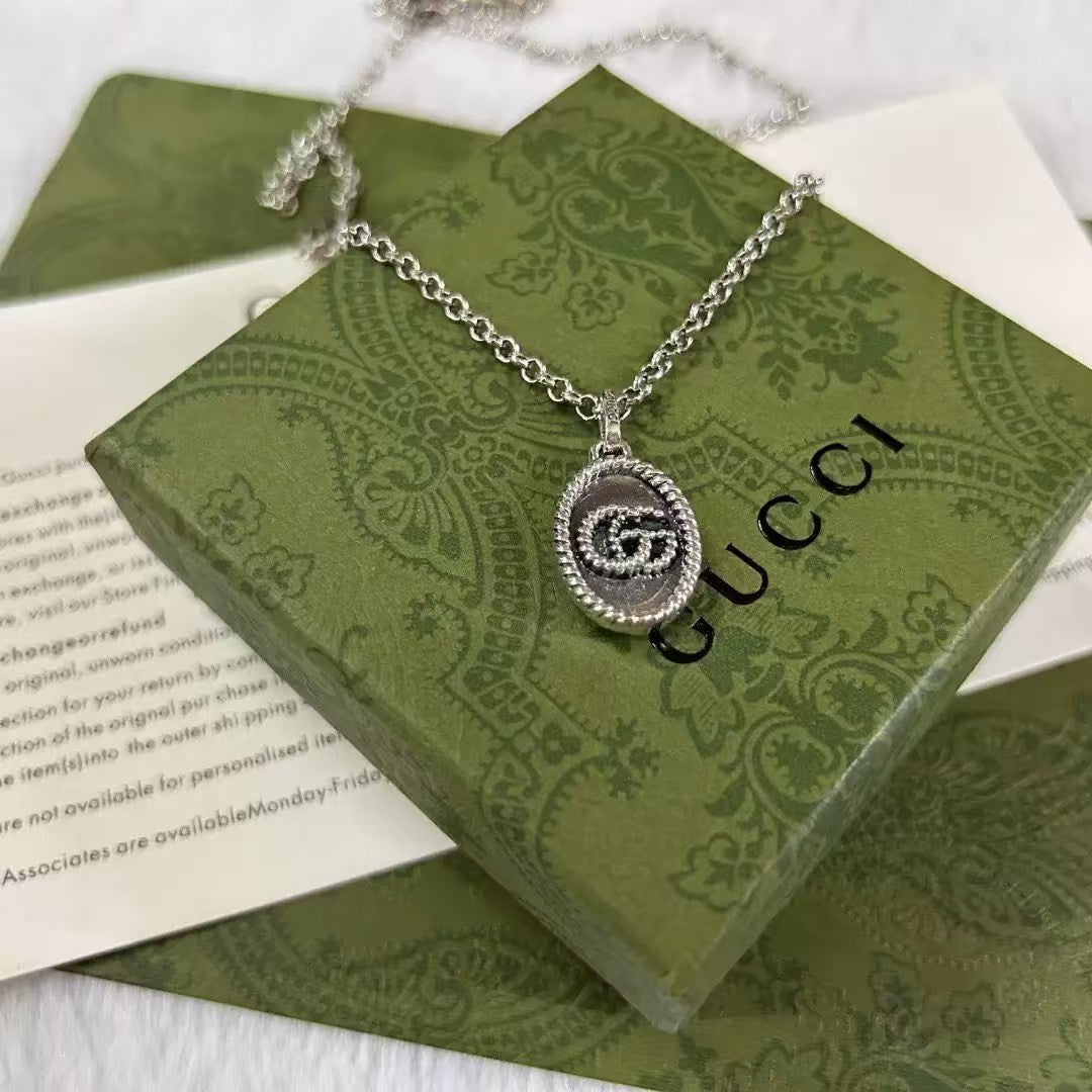 Gucci Silver Logo Pendant Necklace – Decorative Border Medallion
