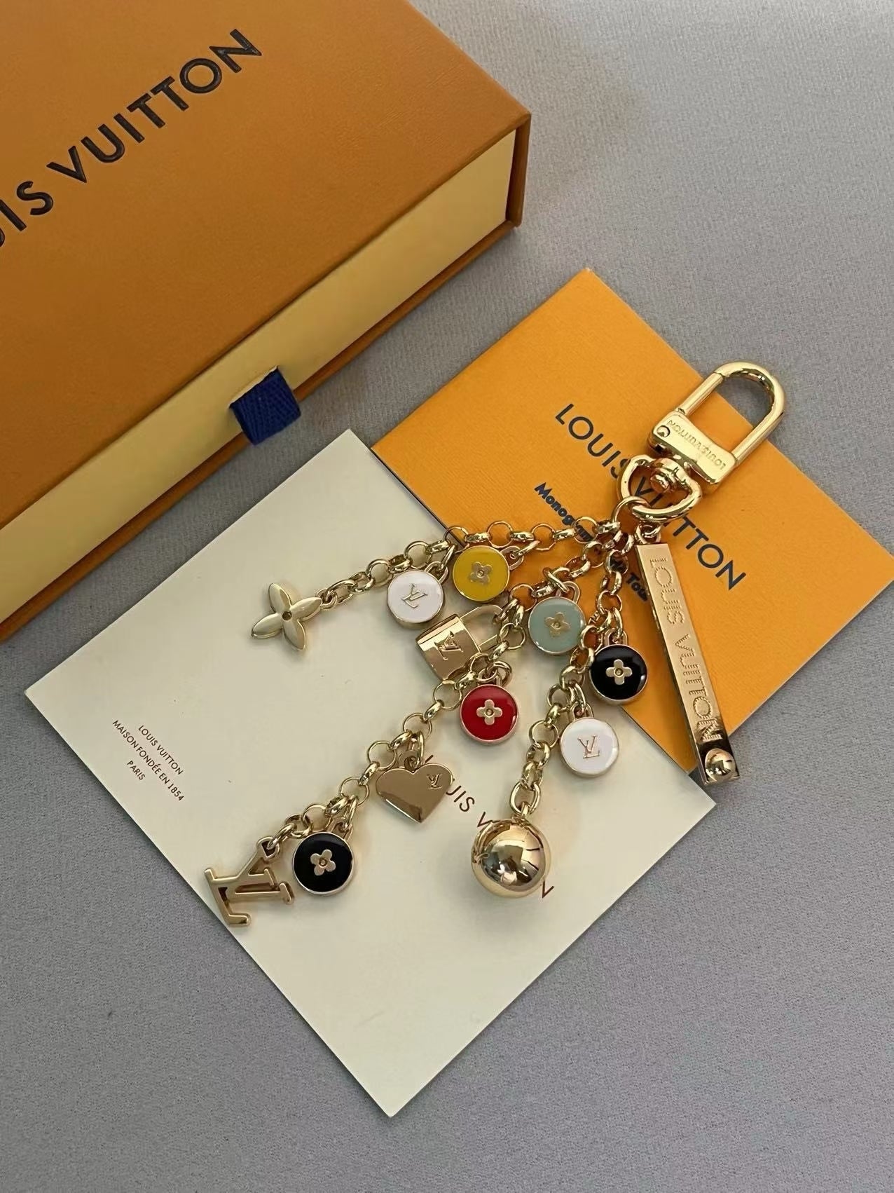 Louis Vuitton Multi-Charm Keychain – Gold-Tone with Monogram, Padlocks & Logo Charms