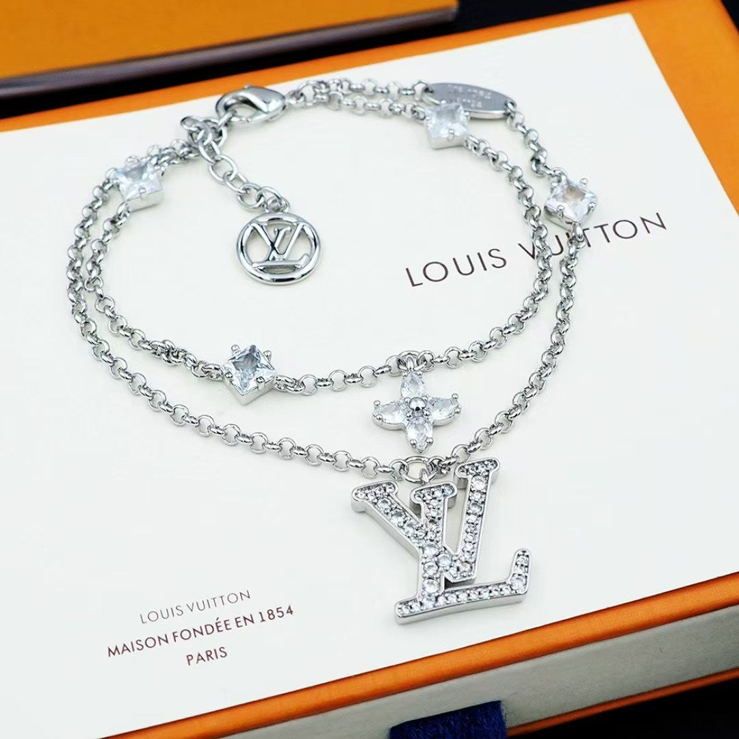 Louis Vuitton Crystal LV Jewelry Set – Gold-Tone Necklace & Bracelet with Sparkling Logo Pendants