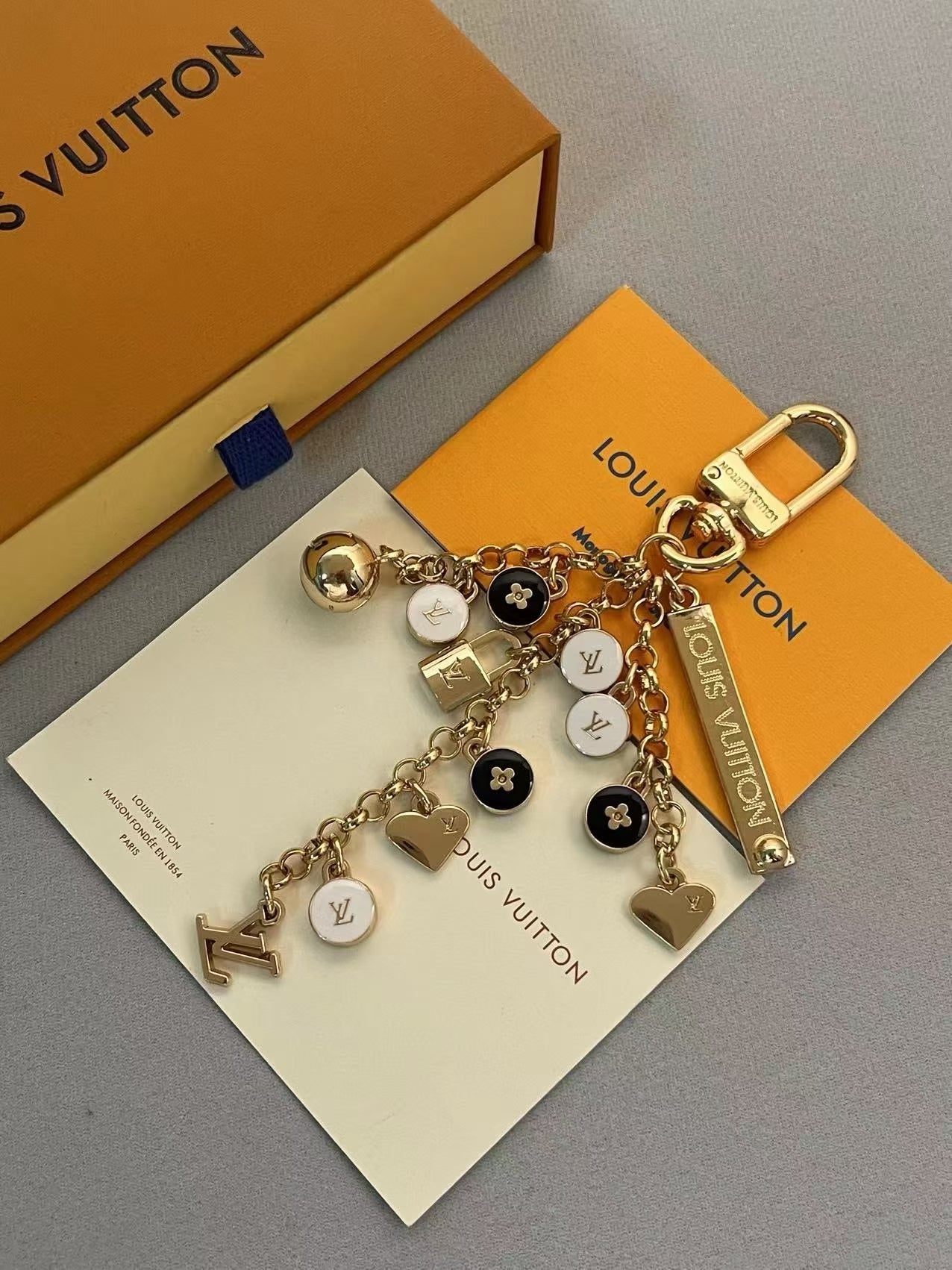 Louis Vuitton Multi-Charm Keychain – Gold-Tone with Monogram, Padlocks & Logo Charms