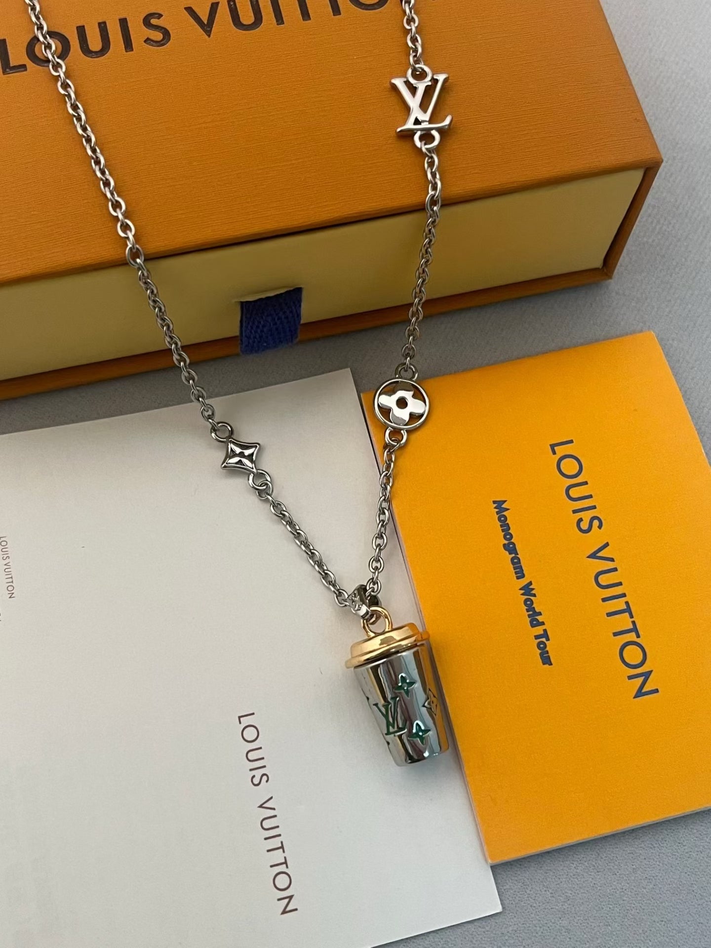 Louis Vuitton Monogram Cup Charm Necklace – Silver Chain with Iconic LV Motifs