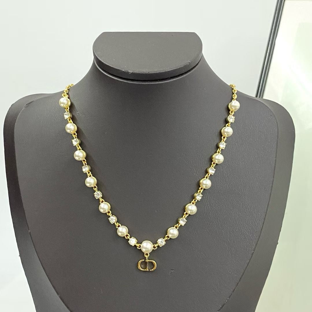 Dior-Inspired Pearl Necklace – Gold Chain with CD Logo Pendant & Gemstone Details