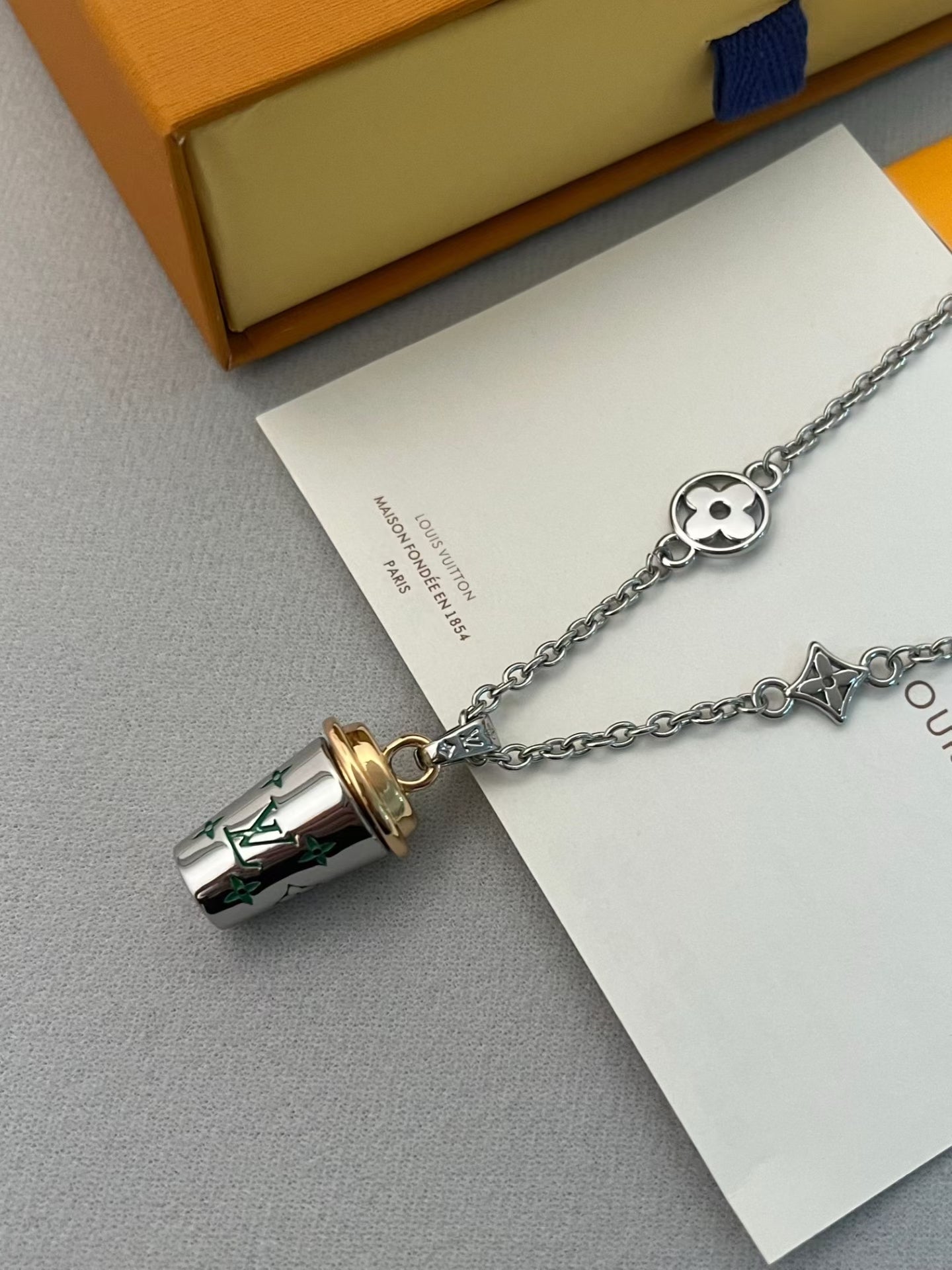 Louis Vuitton Monogram Cup Charm Necklace – Silver Chain with Iconic LV Motifs