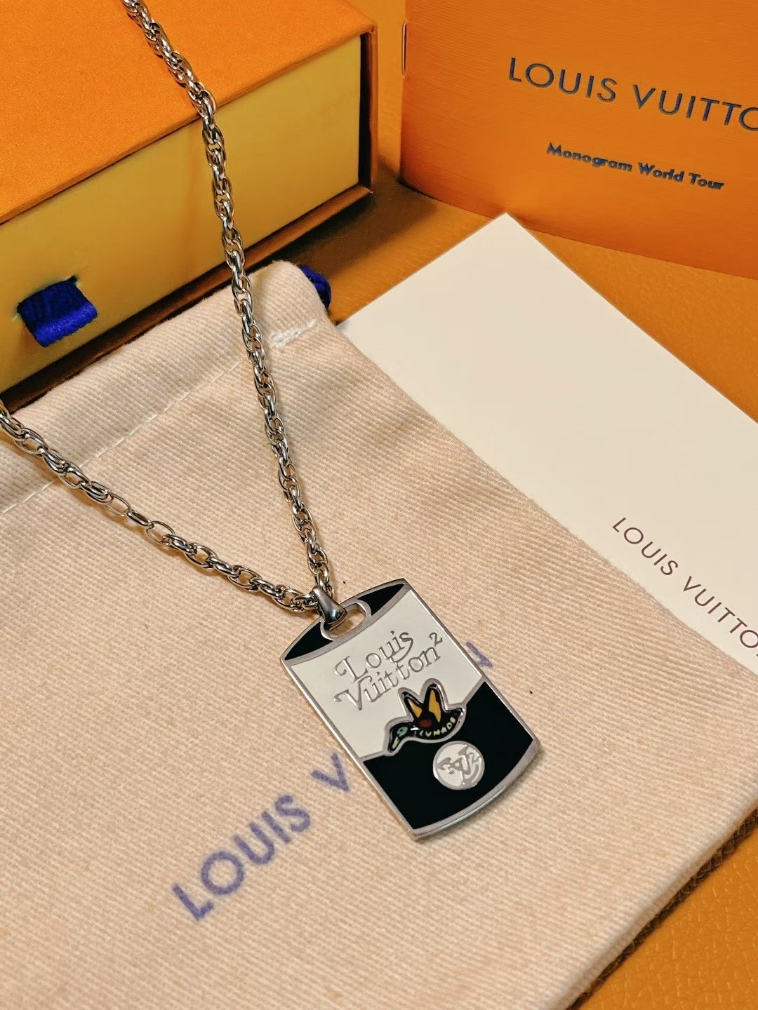 Louis Vuitton TUMAD Butterfly Pendant Necklace – Silver Chain with Engraved Monogram