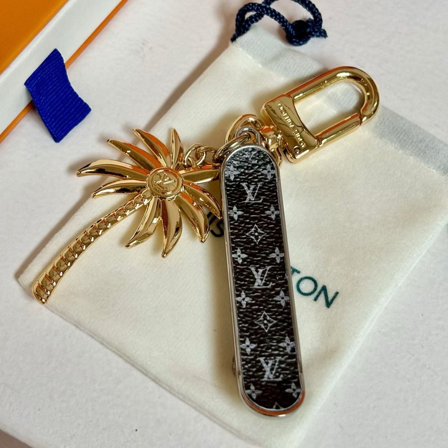 Louis Vuitton Monogram World Tour Bag Charm Tropical Palm Design with Gold Hardware