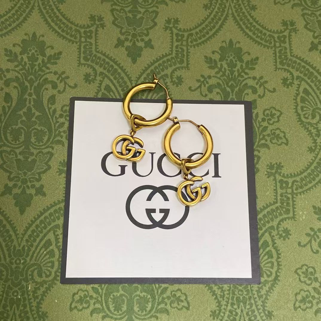 Gucci GG Hoop Earrings – Gold-Tone Hoops with Interlocking GG Logo Charms
