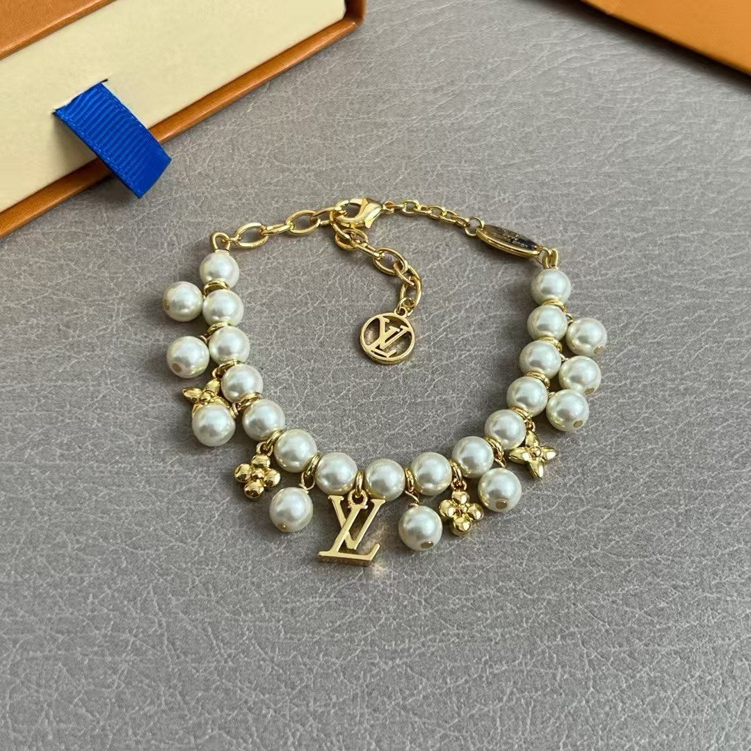 Louis Vuitton Pearl & Charm Bracelet – Gold Chain with LV Logo & Floral Motifs