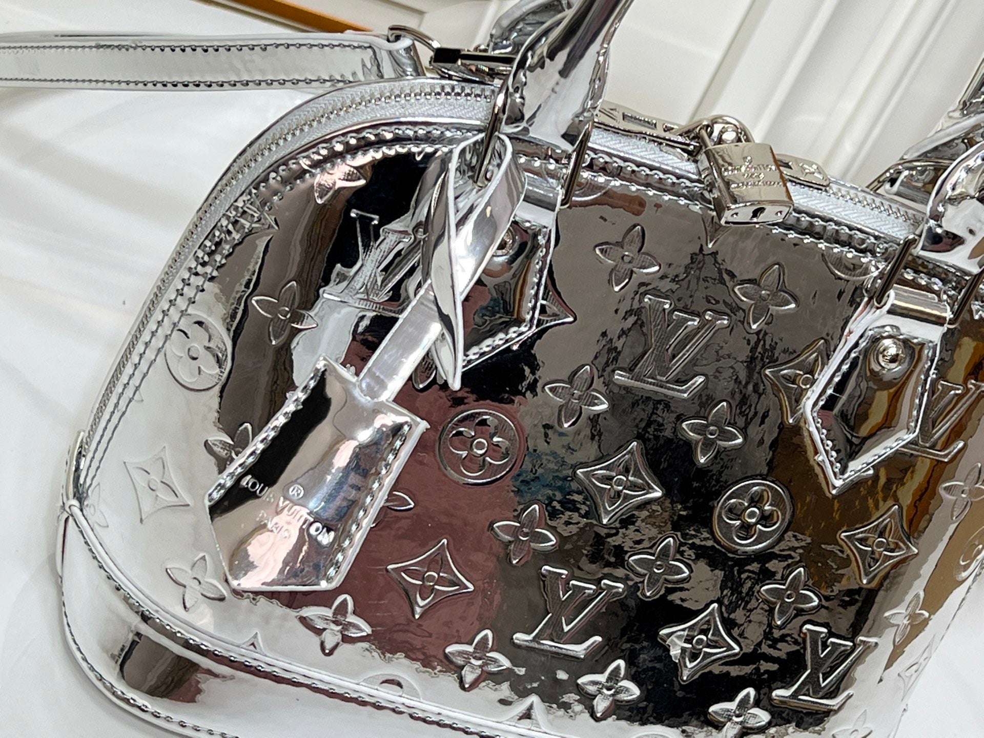 Louis Vuitton Reflective Silver Monogram Handbag – Radiant Icon Edition