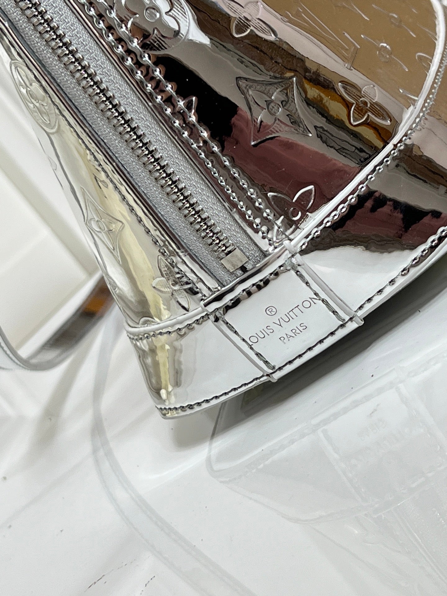 Louis Vuitton Reflective Silver Monogram Handbag – Radiant Icon Edition