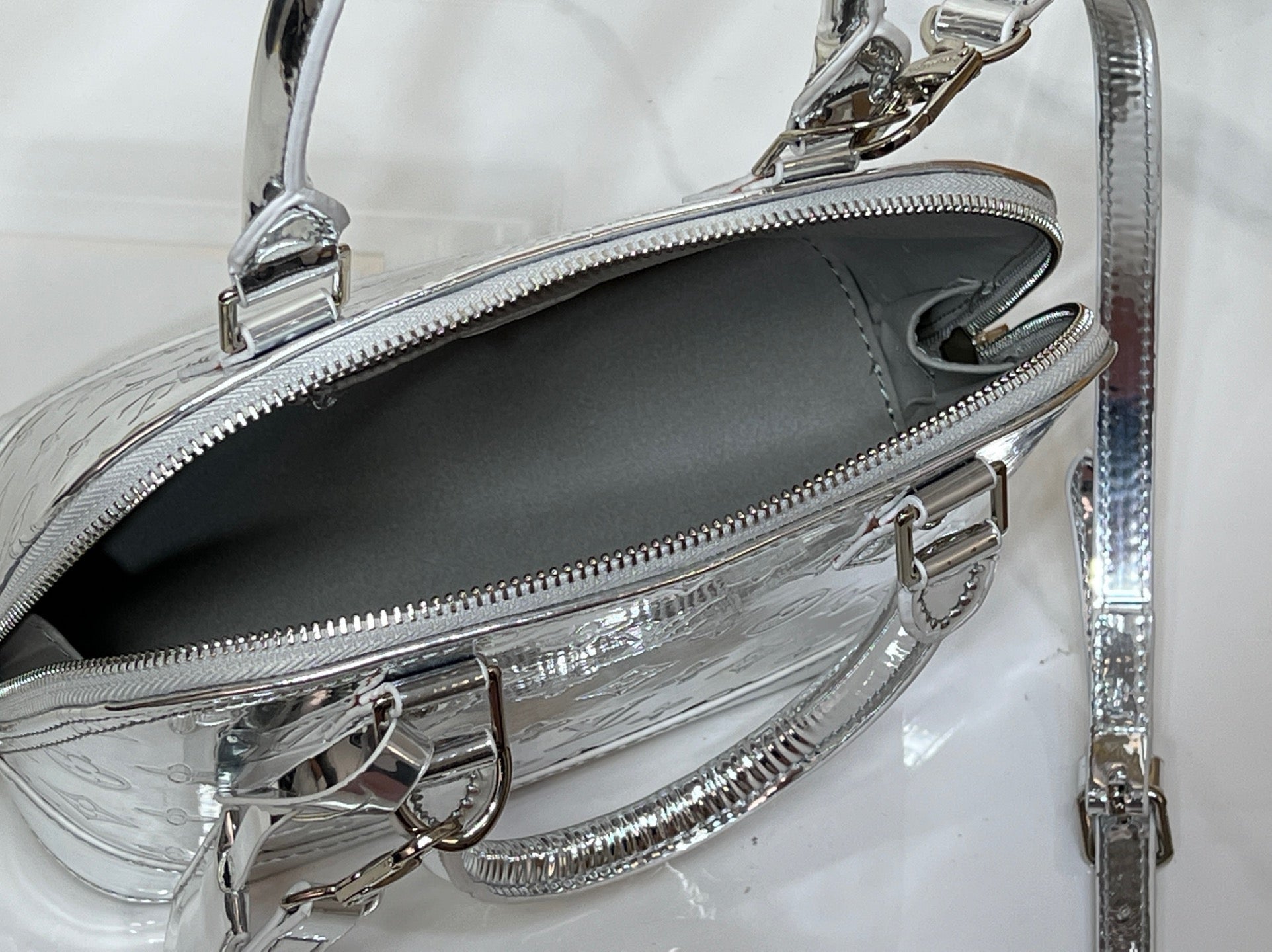 Louis Vuitton Reflective Silver Monogram Handbag – Radiant Icon Edition