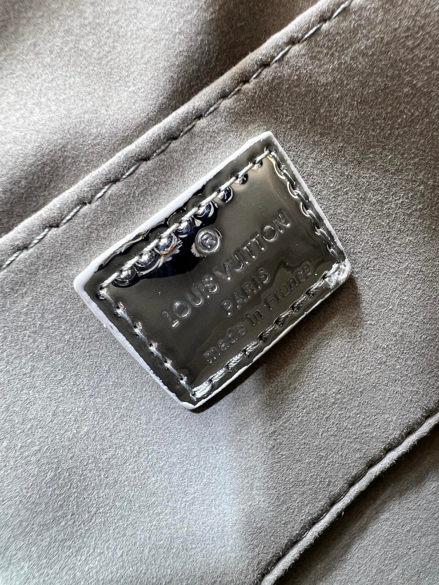 Louis Vuitton Reflective Silver Monogram Handbag – Radiant Icon Edition