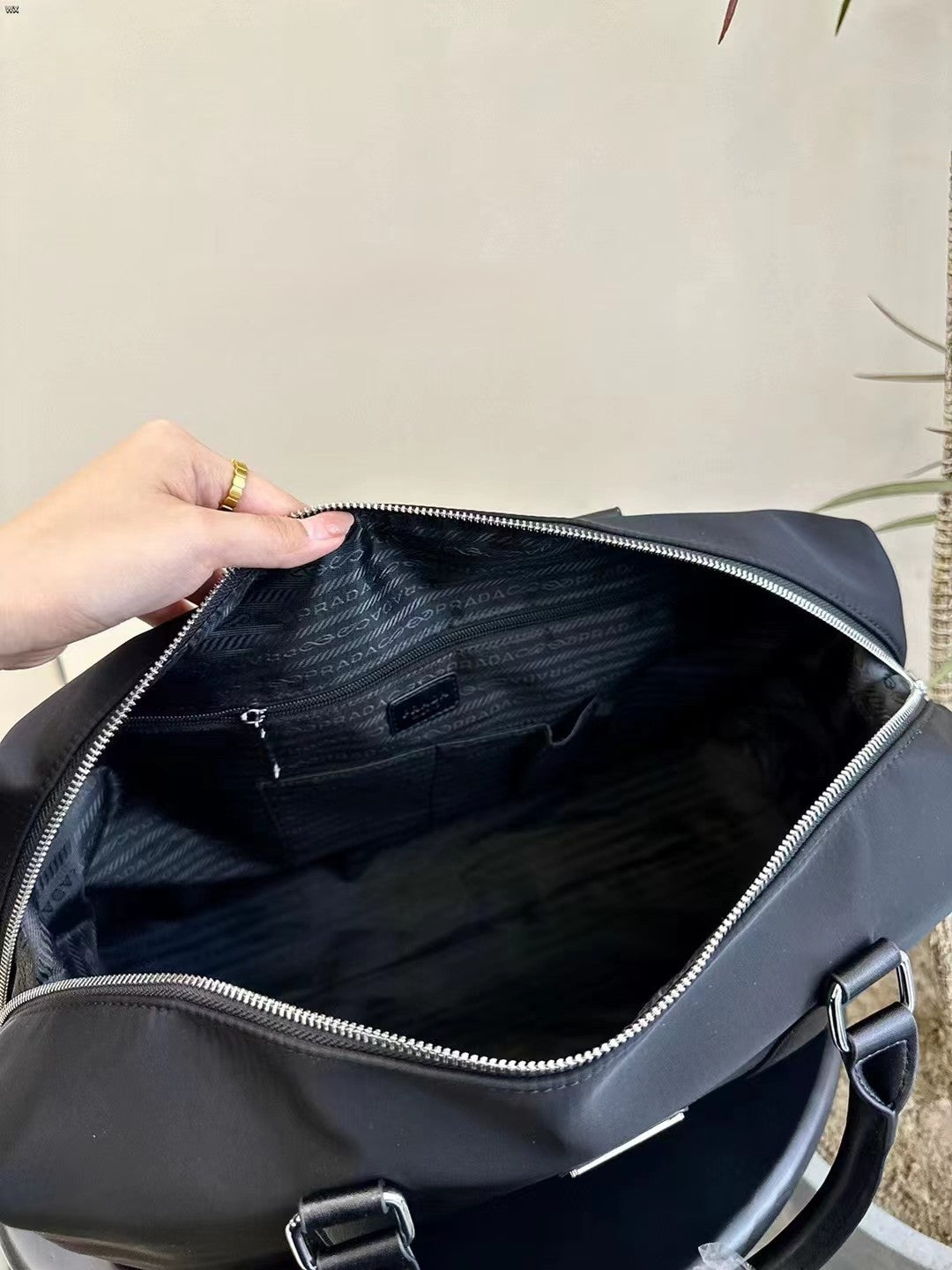 Prada Nylon Duffle Bag Size 47cm – Structured Design with Leather Accents & Silver Hardware