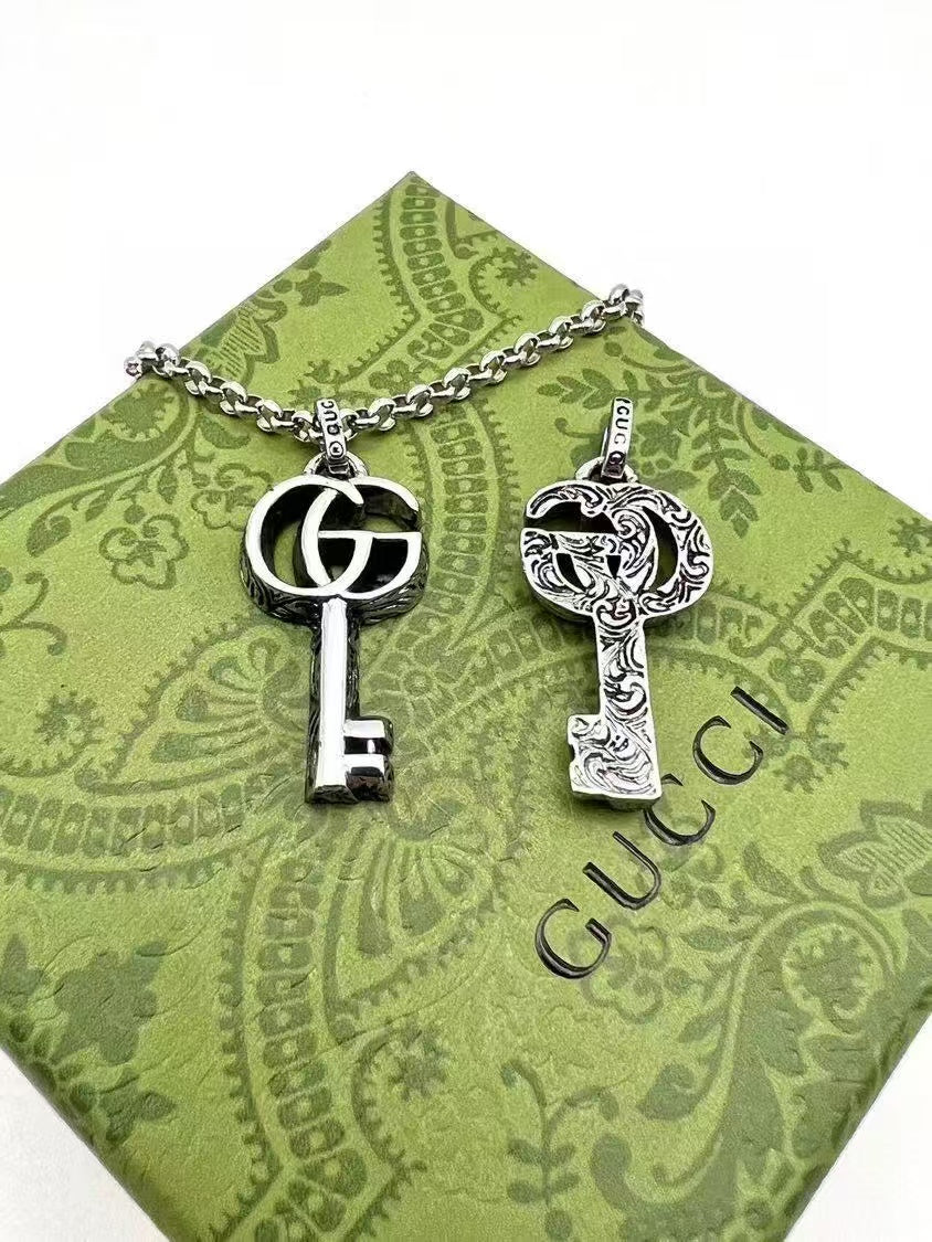 Gucci Silver Key Pendant Necklace – Ornate GG Logo Design