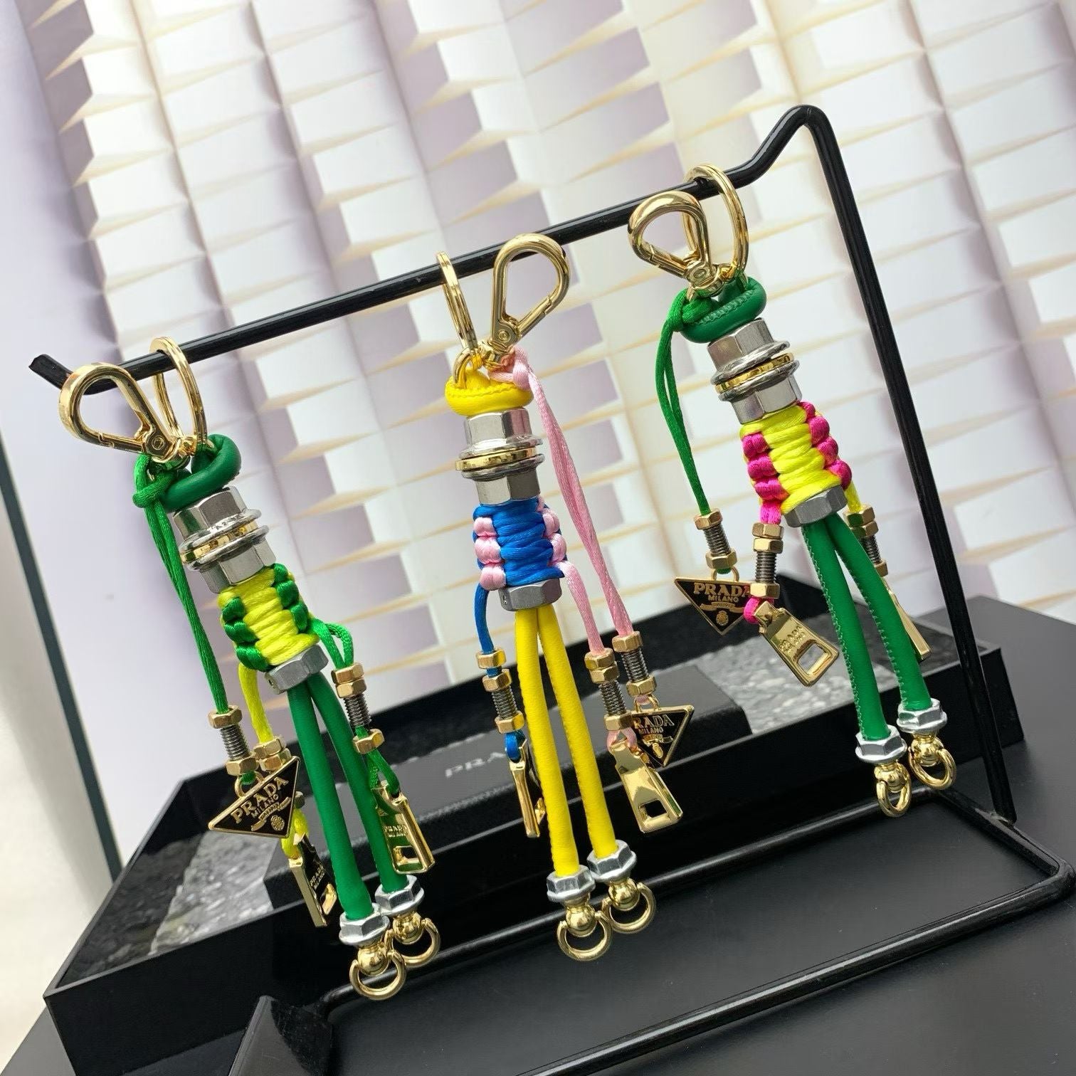 Prada Humanoid Keychain Multicolor Cord Figures with Gold Hardware & Logo Charm