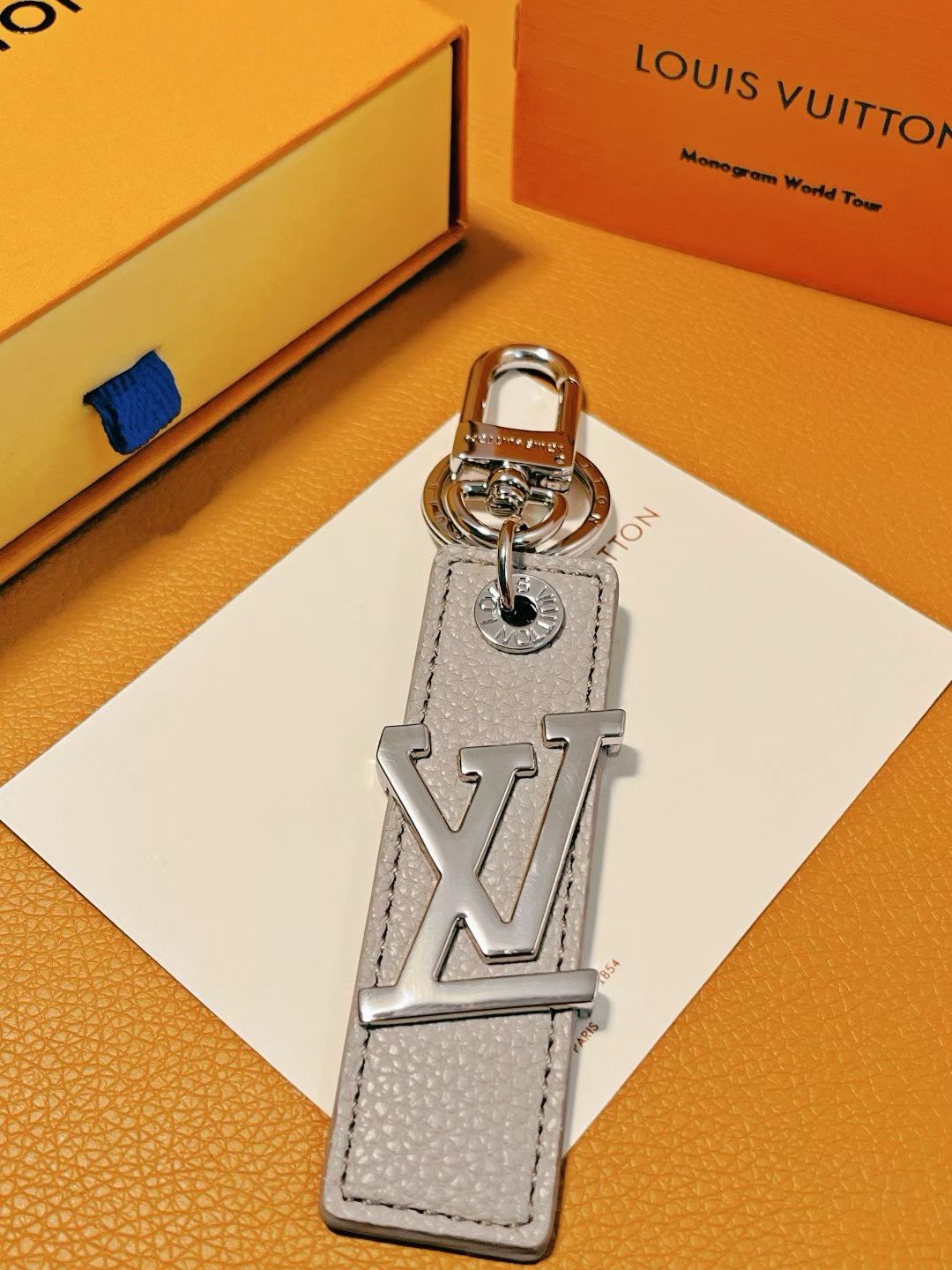 Louis Vuitton LV Logo Keychain – Colorful Leather Strap with Silver Hardware
