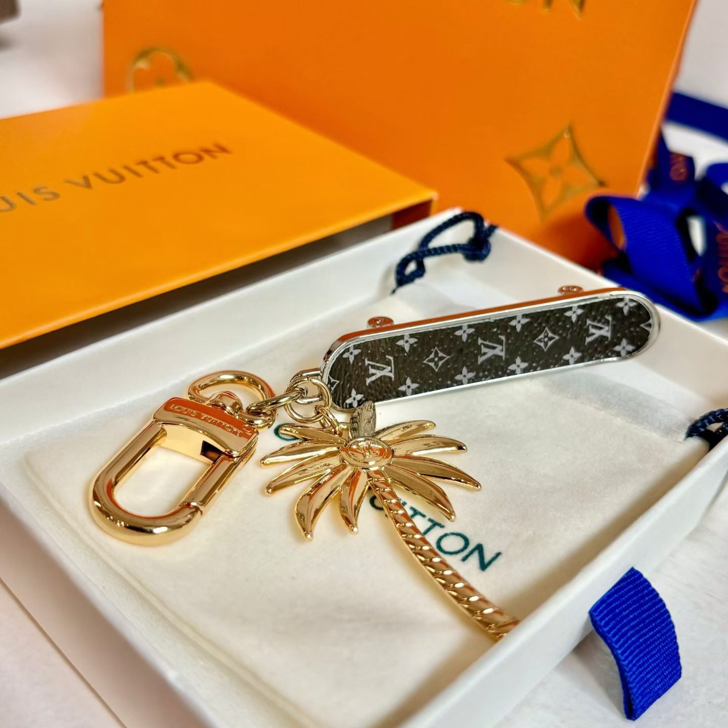 Louis Vuitton Monogram World Tour Bag Charm Tropical Palm Design with Gold Hardware