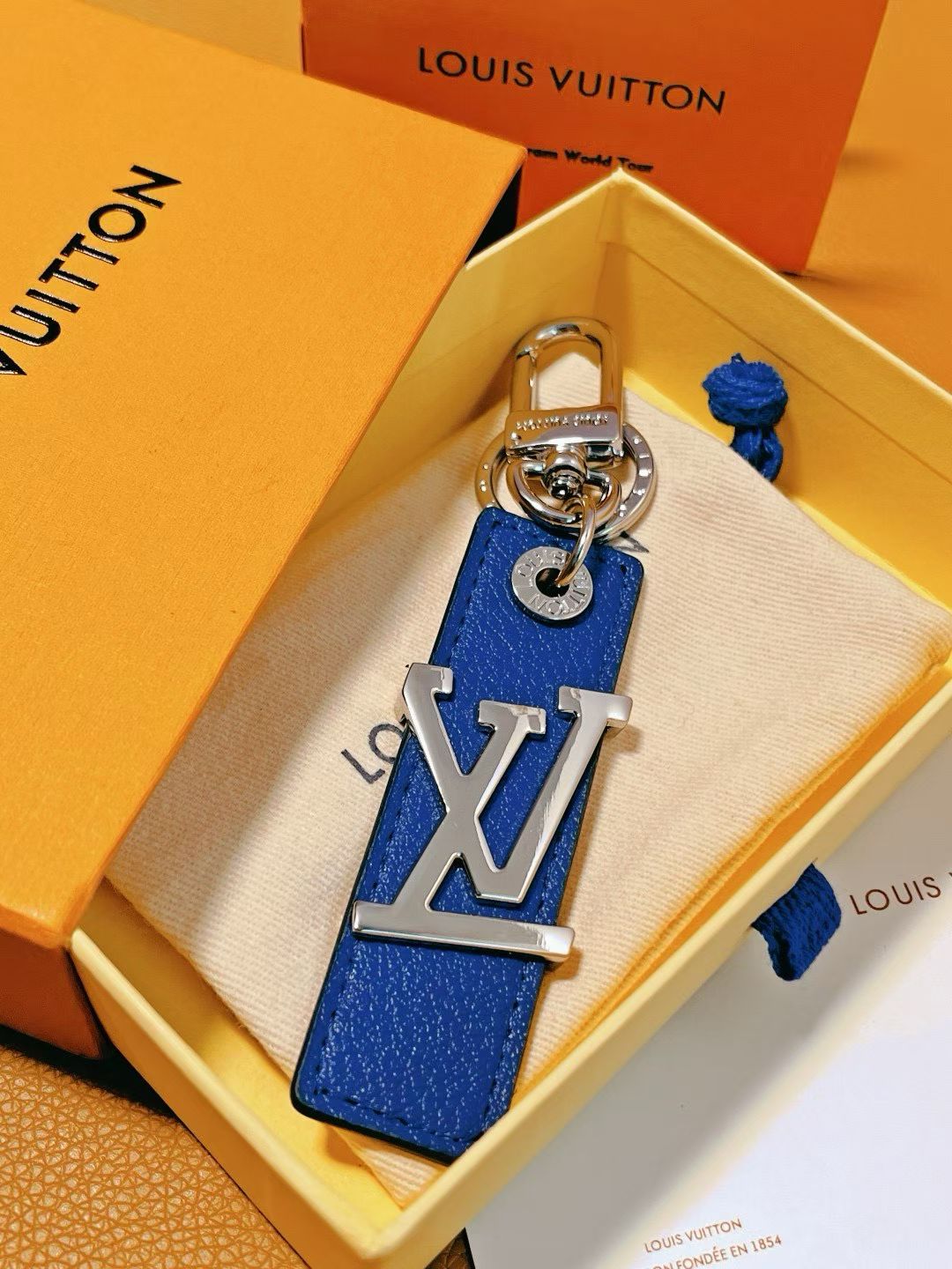 Louis Vuitton LV Logo Keychain – Colorful Leather Strap with Silver Hardware