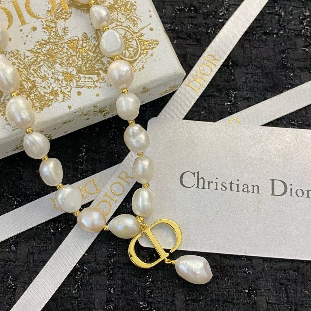 Christian Dior Pearl Necklace – Irregular White Pearls with Gold CD Pendant