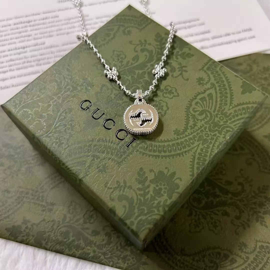 Gucci Interlocking G Necklace – Sterling Silver Medallion with Textured Border