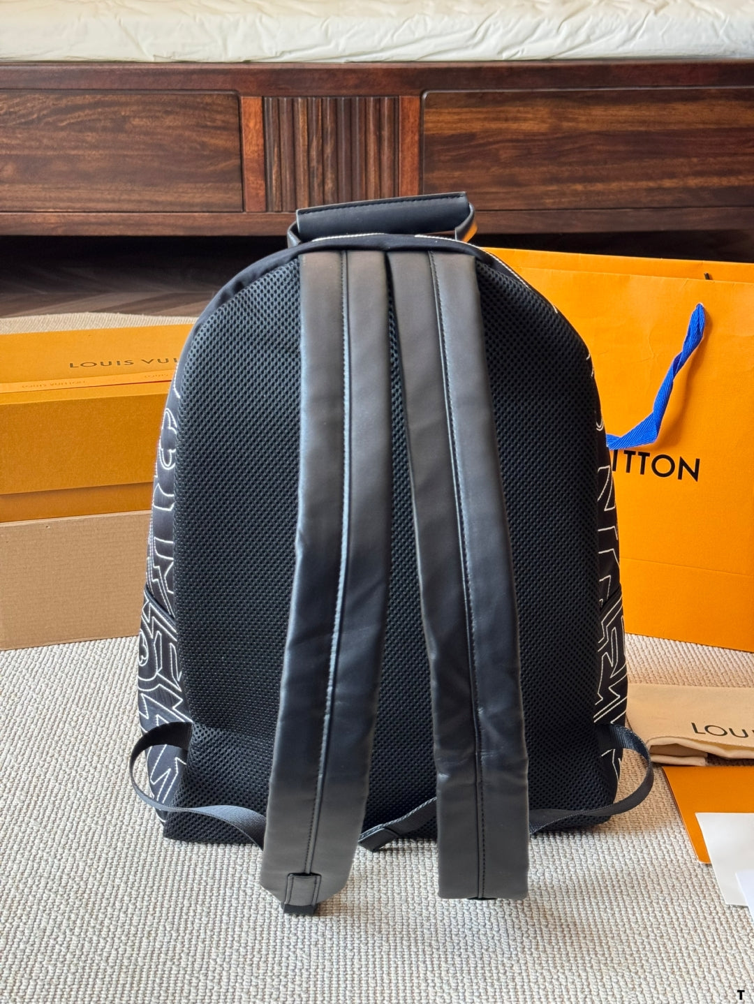 Louis Vuitton Statement Backpack – Black & White Graphic Print with Dual Pockets