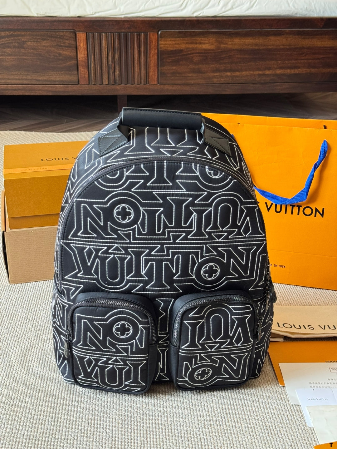 Louis Vuitton Statement Backpack – Black & White Graphic Print with Dual Pockets