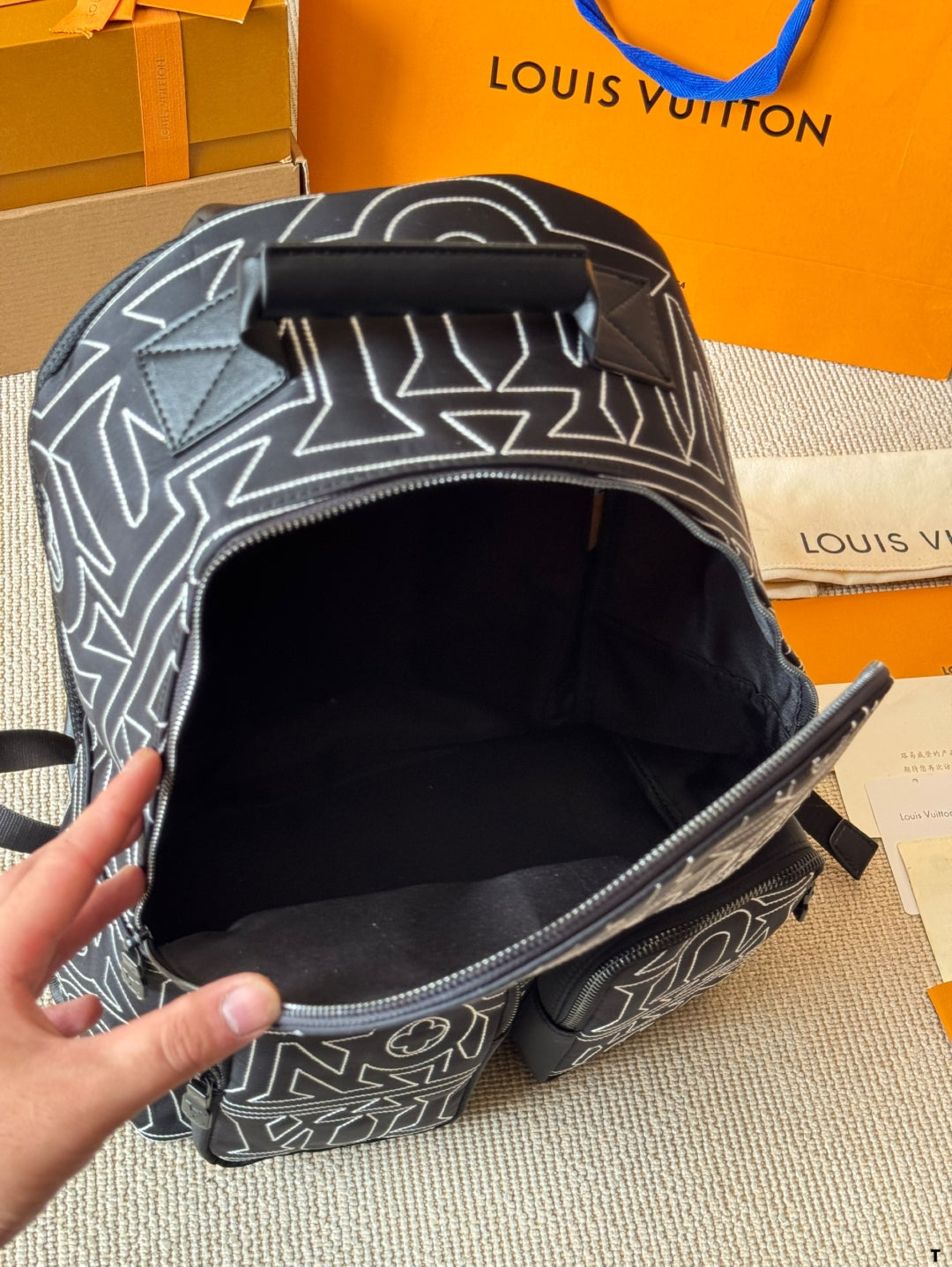 Louis Vuitton Statement Backpack – Black & White Graphic Print with Dual Pockets