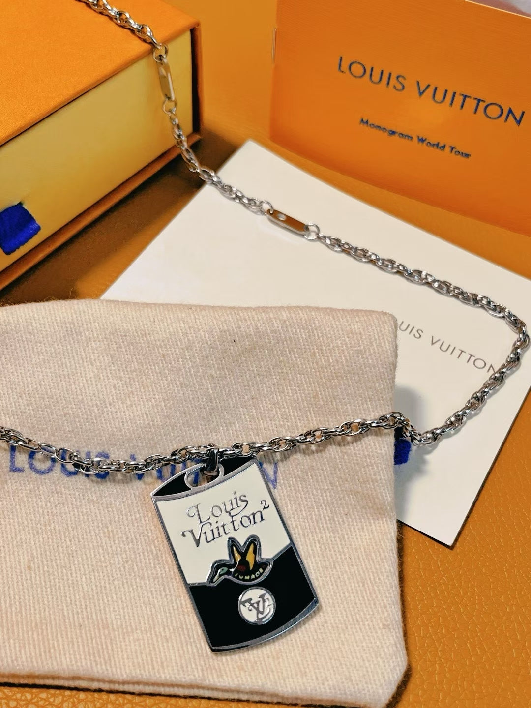 Louis Vuitton TUMAD Butterfly Pendant Necklace – Silver Chain with Engraved Monogram