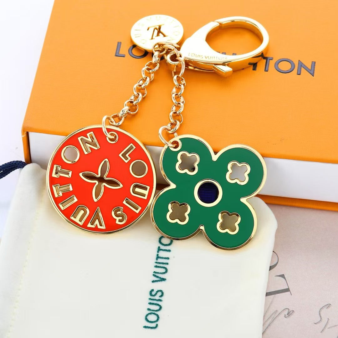 Louis Vuitton Enamel Charm Keychain Duo – Gold-Tone with Colorful Monogram Flower & Star Medallions