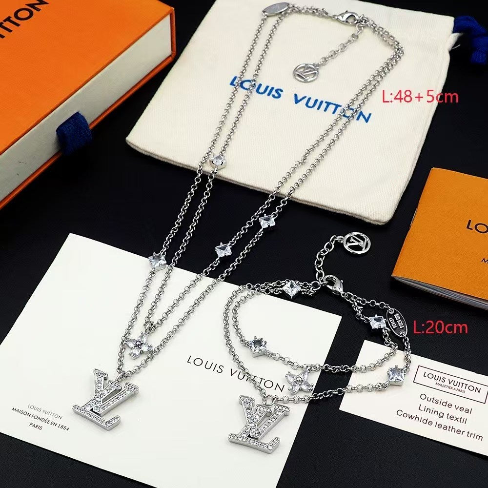 Louis Vuitton Crystal LV Jewelry Set – Gold-Tone Necklace & Bracelet with Sparkling Logo Pendants