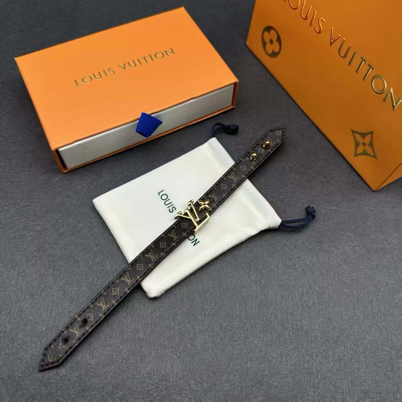 Louis Vuitton Monogram Leather Bracelet – Brown Canvas with Gold LV Logo & Fleur Charm