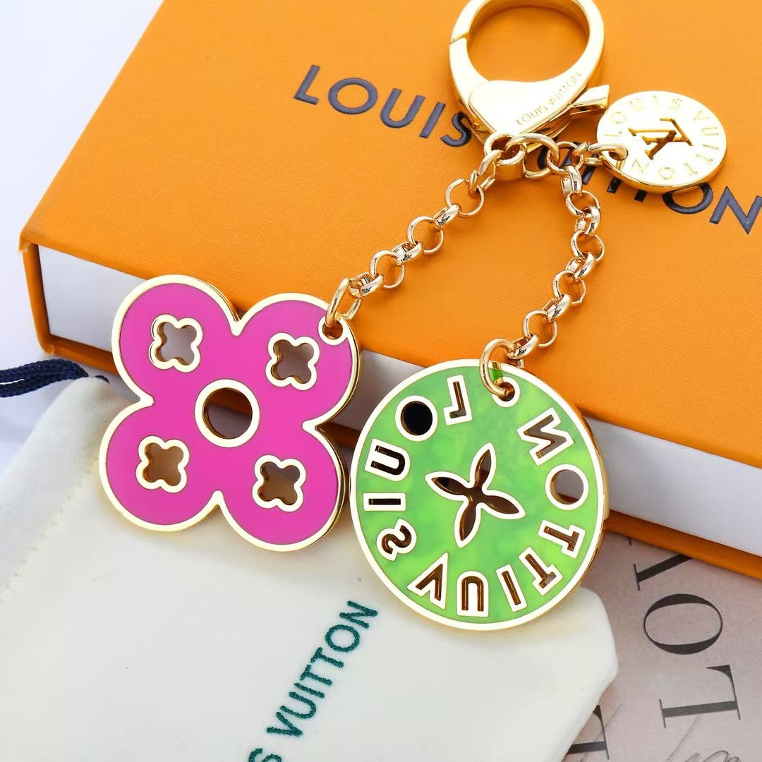 Louis Vuitton Enamel Charm Keychain Duo – Gold-Tone with Colorful Monogram Flower & Star Medallions