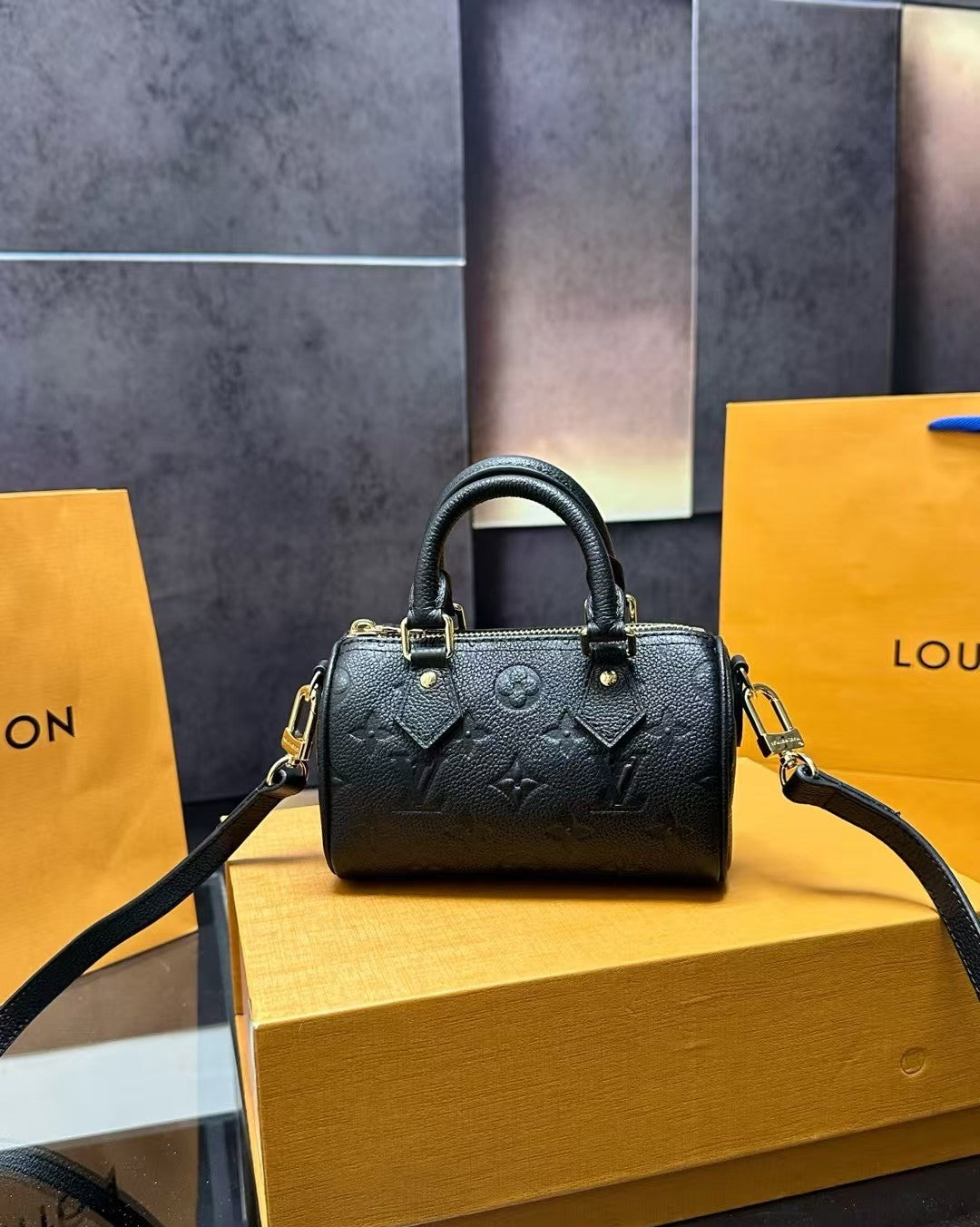 Louis Vuitton Mini Handbag – Black Embossed Monogram with Gold Hardware