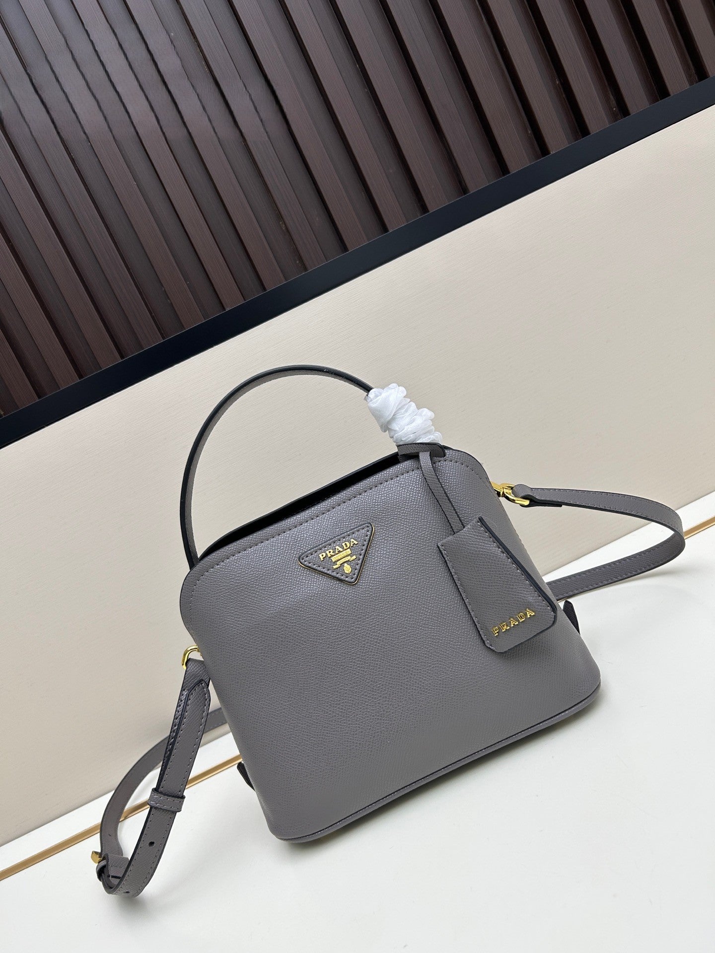Prada Structured Handbag – Black with Gold Logo Plaque & Top Handle