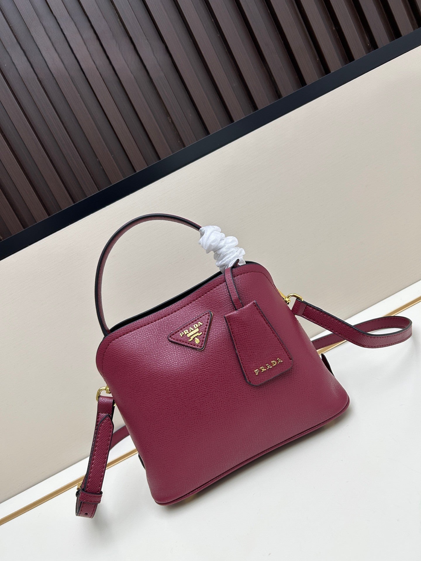 Prada Structured Handbag – Black with Gold Logo Plaque & Top Handle