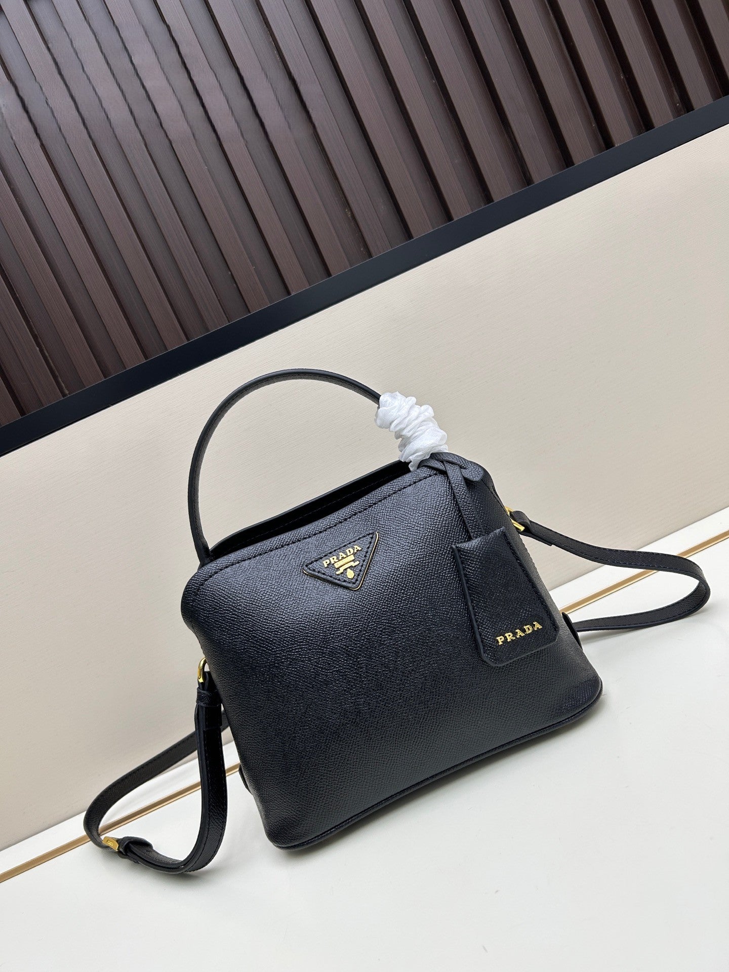 Prada Structured Handbag – Black with Gold Logo Plaque & Top Handle