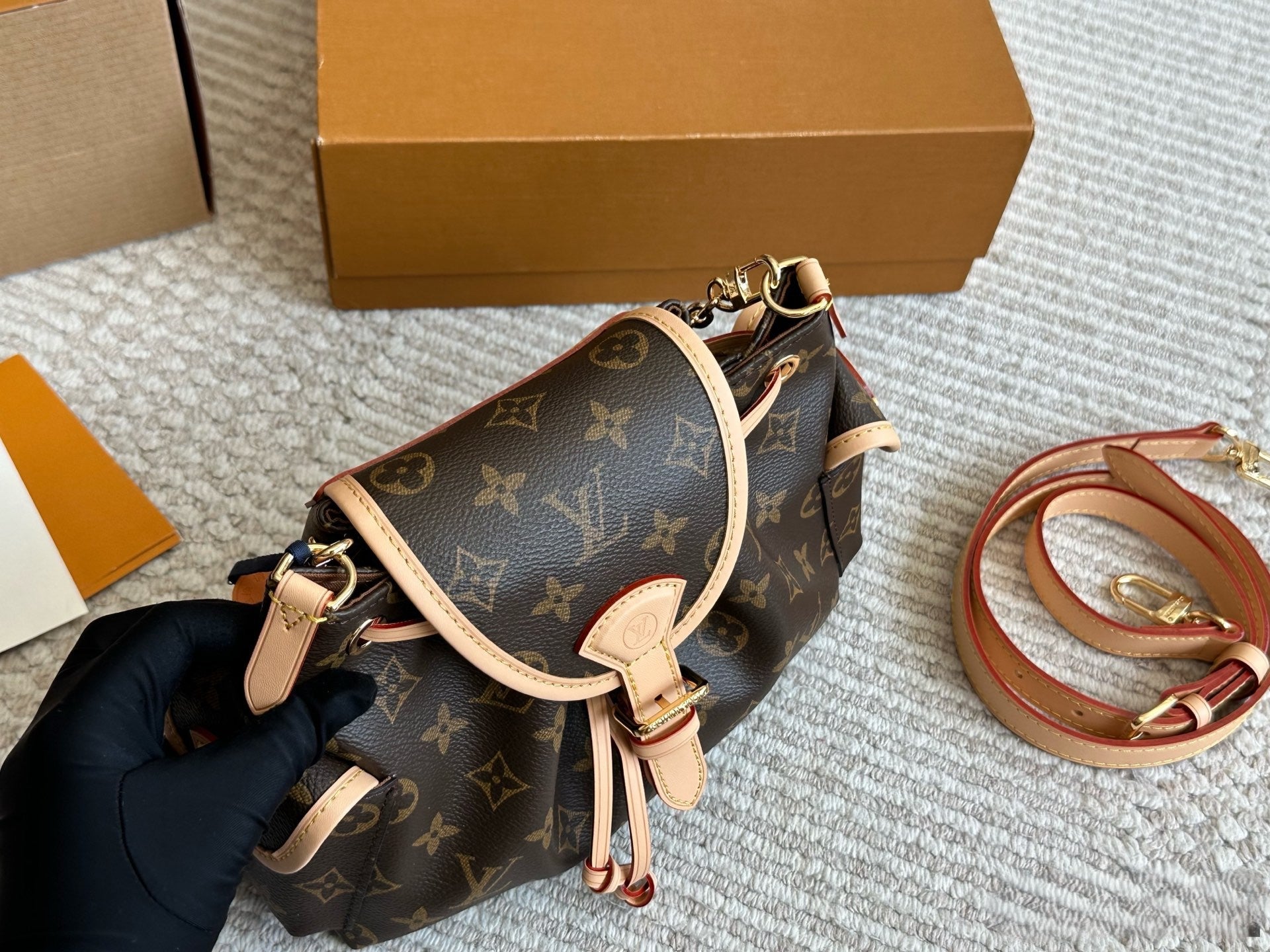 Louis Vuitton Drawstring Flap Handbag with Gold Hardware