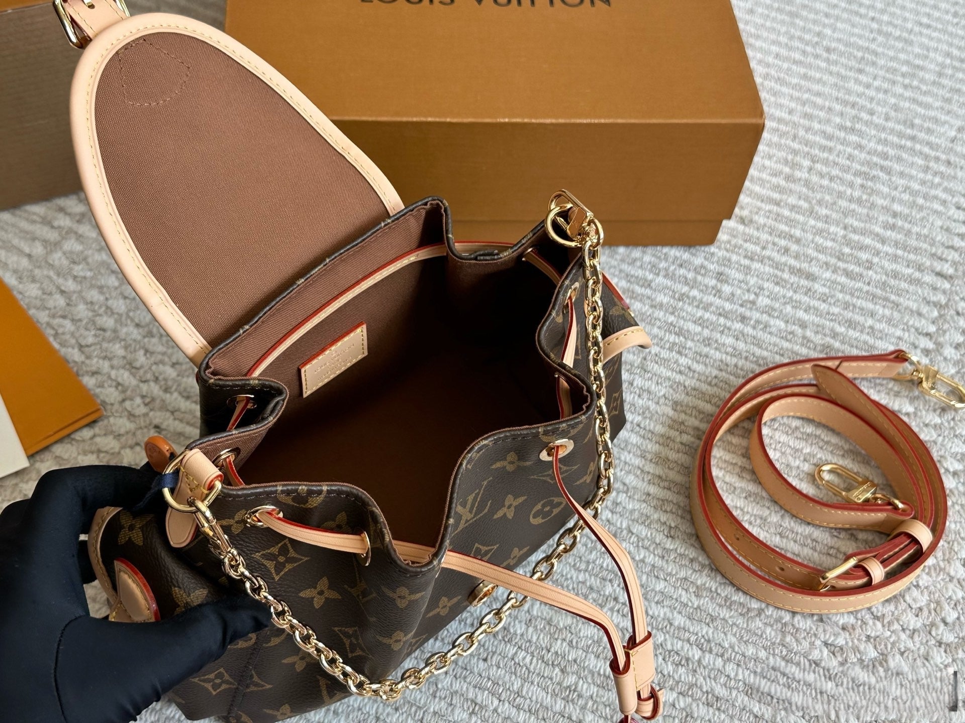 Louis Vuitton Drawstring Flap Handbag with Gold Hardware