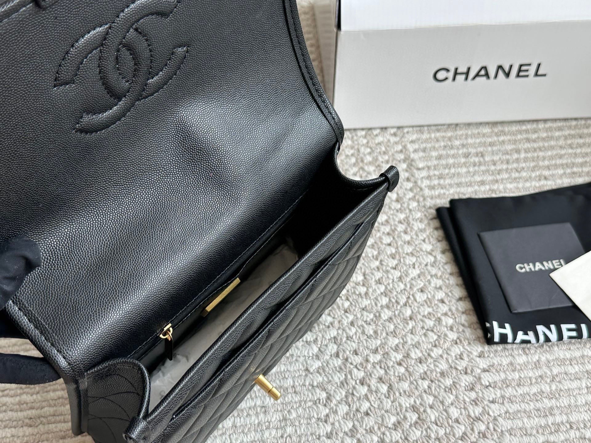 Chanel Quilted Backpack Black Leather with Gold Hardware & Floral Charm